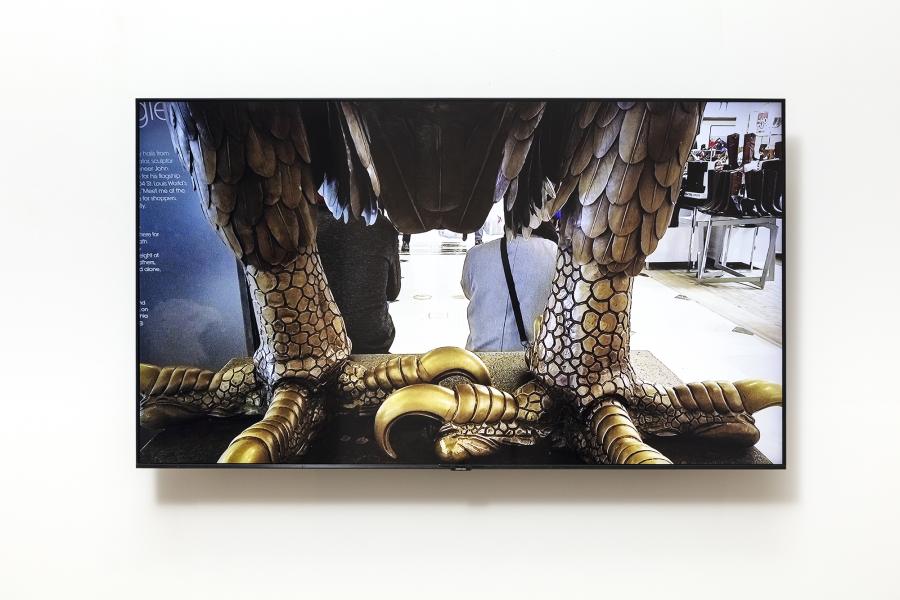 image of a monitor displaying the talons of a large bronze eagle sculpture