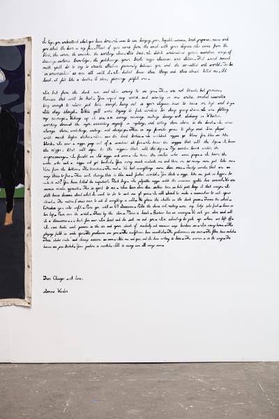 image of hand written scripted text on the gallery wall