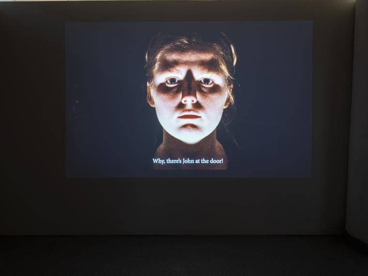 projected image of human head with black background