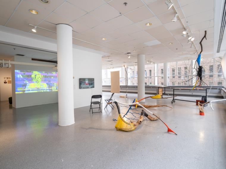 installation image with multiple sculptures and digital video