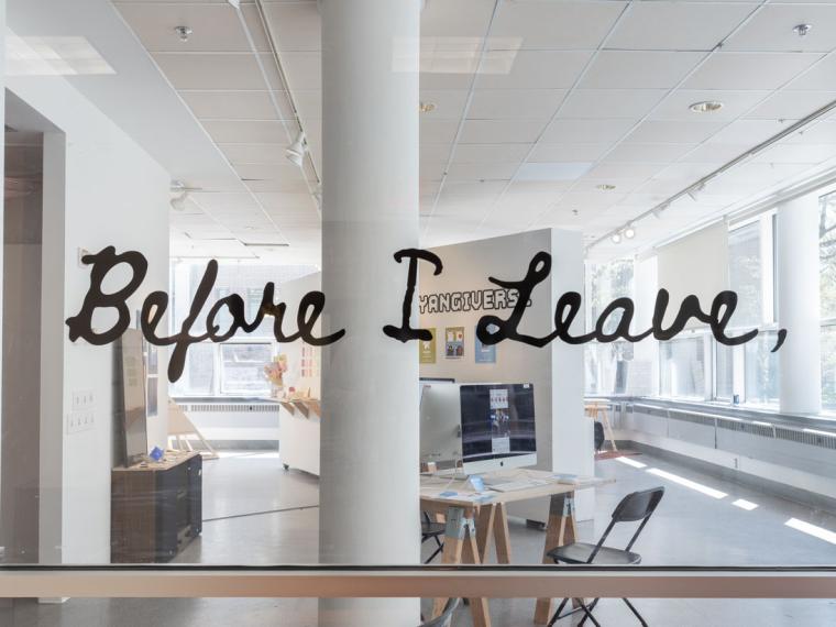 exhibition title installed on the entry window of a gallery