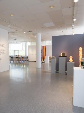 installation image of multiple wall and floor pieces installed in a gallery