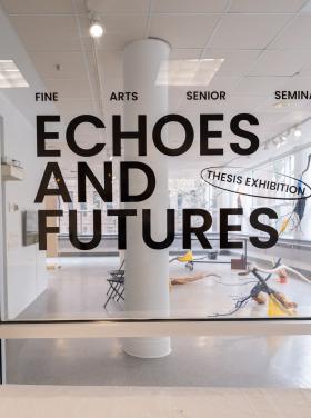 exhibition title installed on the entry glass of a gallery